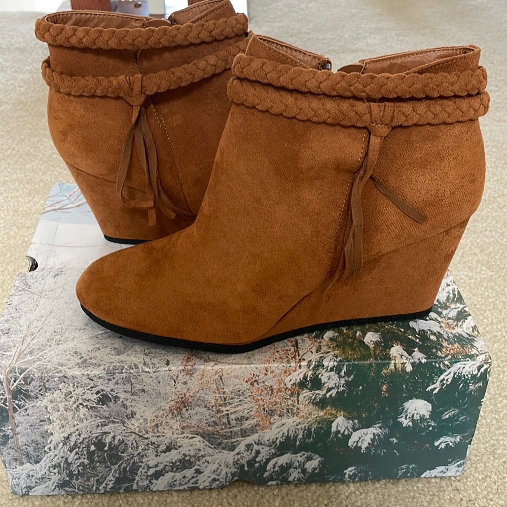 Never worn fawn  wedge bootie with zipper and braid details.